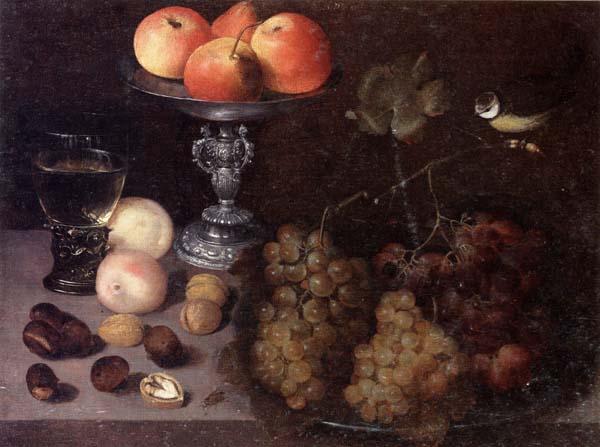 Georg Flegel Still life of grapes on a pewter dish,together with peaches,nuts,a glass roemer and a silver tazza containing apples and pears,and a blue-tit